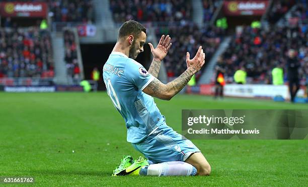 Marko Arnautovic of Stoke City celebrates scoring his sides first goal during the Premier League match between Sunderland and Stoke City at Stadium...