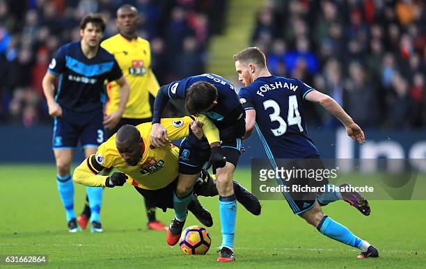 Stefano Okaka of Watford is fouled by Marten de Roon of Middlesbrough during the Premier League match between Watford and Middlesbrough at Vicarage...