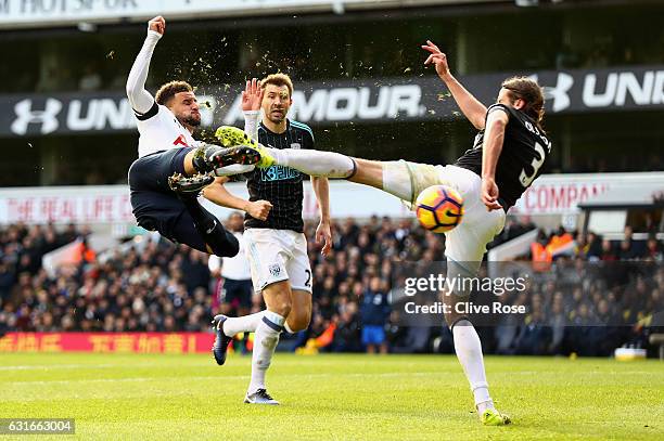 Kyle Walker of Tottenham Hotspur volleys while Jonas Olsson of West Bromwich Albion attempts to block during the Premier League match between...