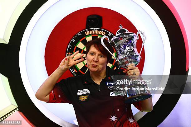 Lisa Ashton of England poses with the trophy after victory in her Women's Final match against Corrine Hammond of Australia on Day Eight of the BDO...