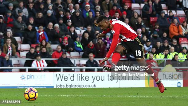 Jermain Defoe of Sunderland scores his sides first goal during the Premier League match between Sunderland and Stoke City at Stadium of Light on...