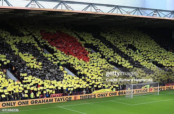 Watford fans create a display with cards as they pay tribute to former manager Graham Taylor who passed away at the age of 72 on Thursday prior to...