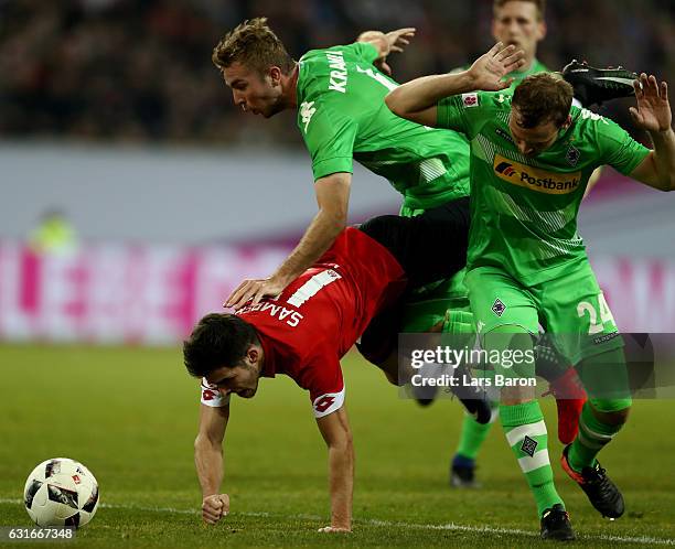 Jairo Samperio of Mainz is challenged by Christoph Kramer of Moenchengladbach and Tony Jantschke of Moenchengladbach during the Telekom Cup 2017...