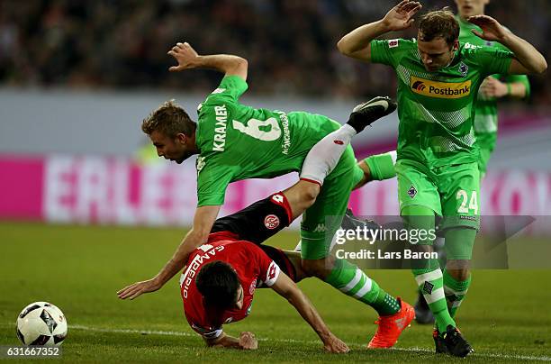 Jairo Samperio of Mainz is challenged by Christoph Kramer of Moenchengladbach and Tony Jantschke of Moenchengladbach during the Telekom Cup 2017...