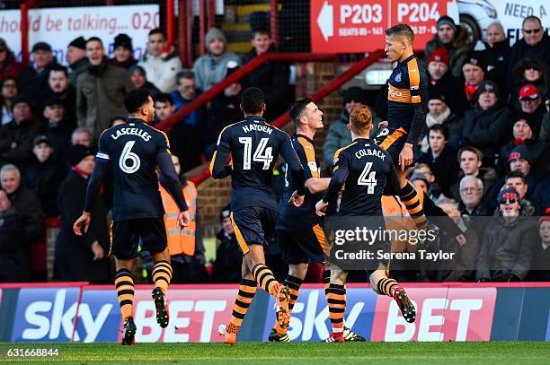 Dwight Gale of Newcastle United jumps in the air celebrating to teammates after scoring the opening goal during the Championship Match between...