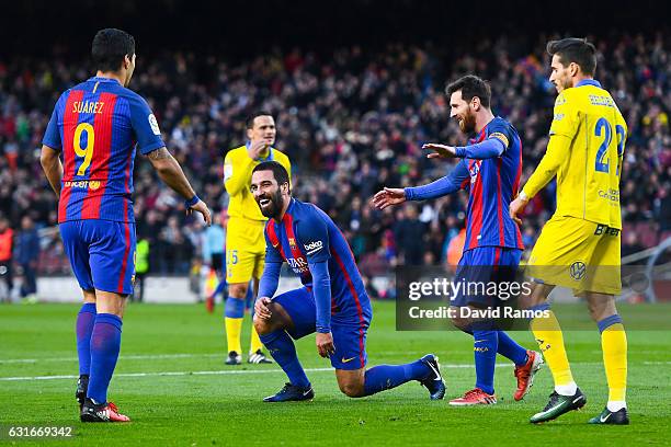 Ardan Turan of FC Barcelona celebrates with his team mates Luis Suarez and Lionel Messi after scoring his team's fourth goalduring the La Liga match...