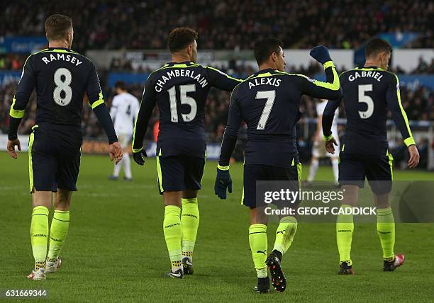 Arsenal's Chilean striker Alexis Sanchez celebrates scoring his team's fourth goal during the English Premier League football match between Swansea...