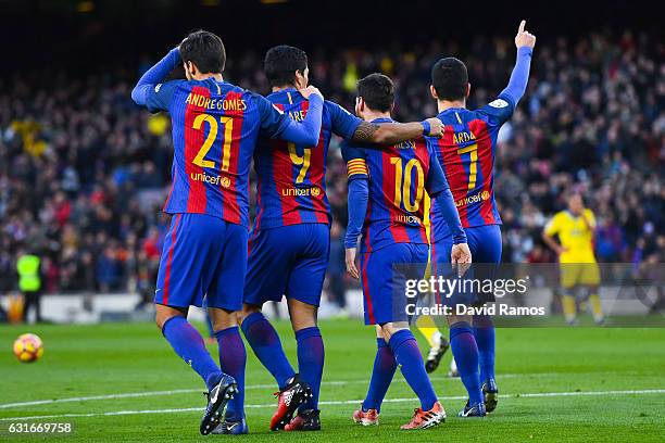 Ardan Turan of FC Barcelona celebrates with his team mates Andre Gomes, Luis Suarez and Lionel Messi after scoring his team's fourth goalduring the...