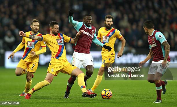 Damien Delaney of Crystal Palace tackles Pedro Obiang of West Ham United during the Premier League match between West Ham United and Crystal Palace...