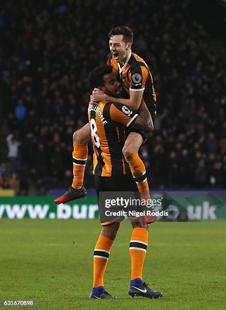 Tom Huddlestone of Hull City celebrates his side third goal with Ryan Mason of Hull City during the Premier League match between Hull City and AFC...