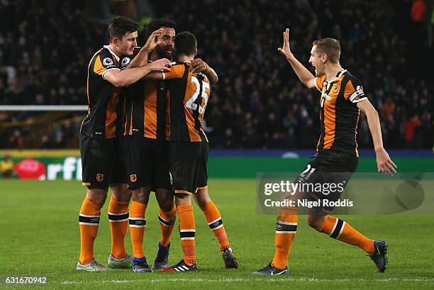 Tom Huddlestone of Hull City celebrates his side third goal with his Hull City team mates during the Premier League match between Hull City and AFC...