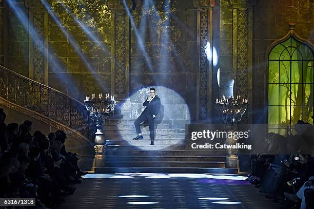 Austin Mahone performs on the runway at the Dolce & Gabbana Autumn Winter 2017 fashion show during Milan Menswear Fashion Week on January 14, 2017 in...