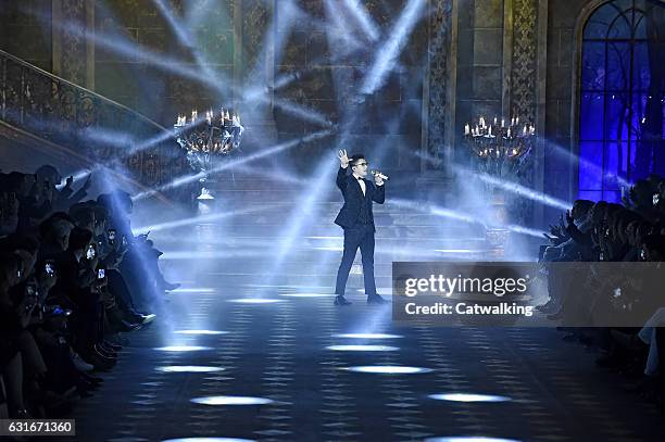 Austin Mahone performs on the runway at the Dolce & Gabbana Autumn Winter 2017 fashion show during Milan Menswear Fashion Week on January 14, 2017 in...