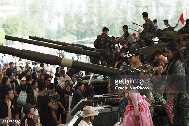 Thai children climb a military vehicle during the National Children's Day event inside a military base in Bangkok, Thailand, on 14 January 2017.