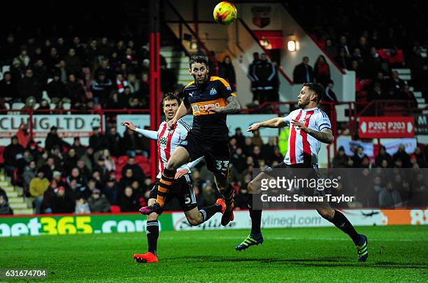 FBRENTFORD, ENGLAND Daryl Murphy of Newcastle United scores Newcastle's second goal during the Championship Match between Brentford and Newcastle...