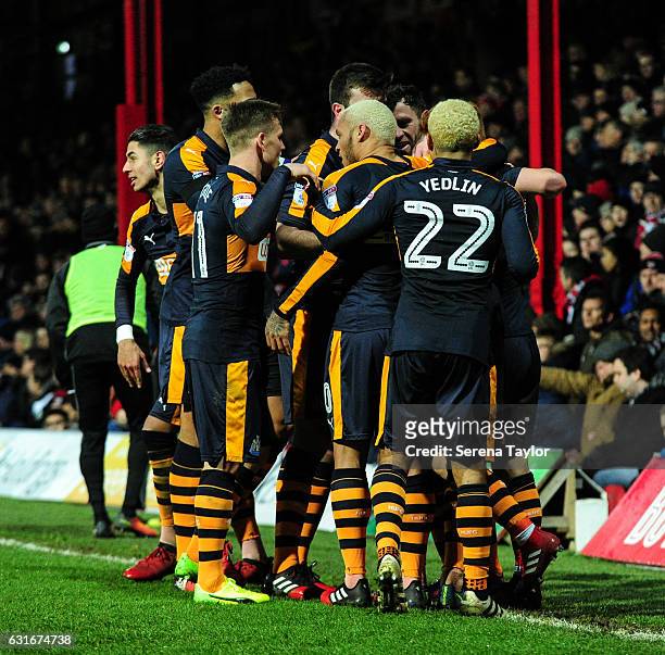FBRENTFORD, ENGLAND Daryl Murphy of Newcastle United is swamped by teammates after scoring Newcastle's second goal during the Championship Match...