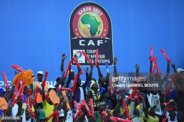 Gabon supporters cheer after their team scored a goal during the 2017 Africa Cup of Nations group A football match between Gabon and Guinea-Bissau at...