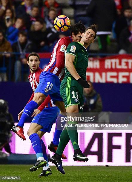 Atletico Madrid's Croatian defender Sime Vrsaljko vies with Betis' forward Alex Alegria during the Spanish league football match Club Atletico de...
