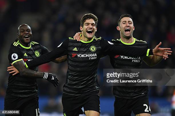 Marcos Alonso of Chelsea celebrates with teammates Victor Moses and Gary Cahill after scoring his team's second goal during the Premier League match...