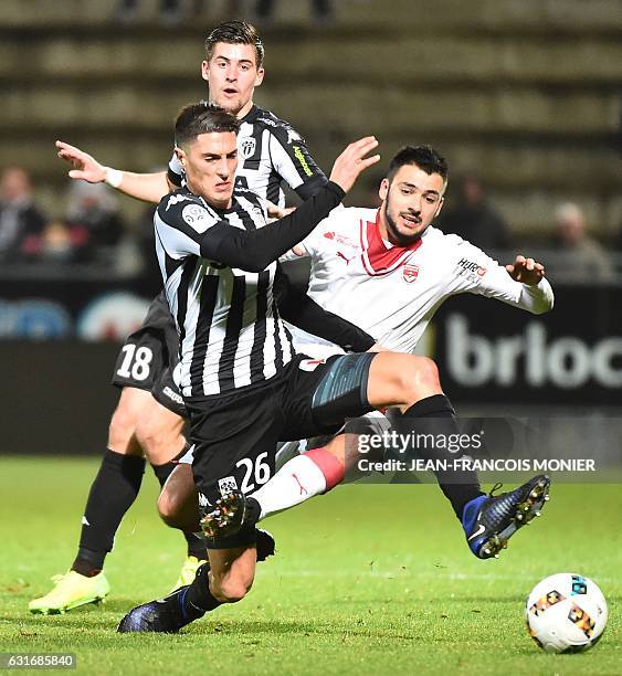 Angers's Algerian defender Mehdi Tahrat vies with Bordeaux's French forward Gaetan Laborde during the French L1 football match between Angers and...