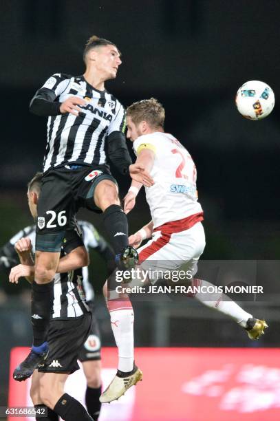 Angers's Algerian defender Mehdi Tahrat vies with Bordeaux's French defender Gregory Sertic during the French L1 football match between Angers and...