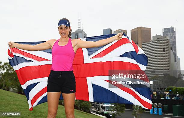 Johanna Konta of Great Britain poses with the Union Jack in front of the Melbourne skyline prior to her first practice session ahead of the 2017...