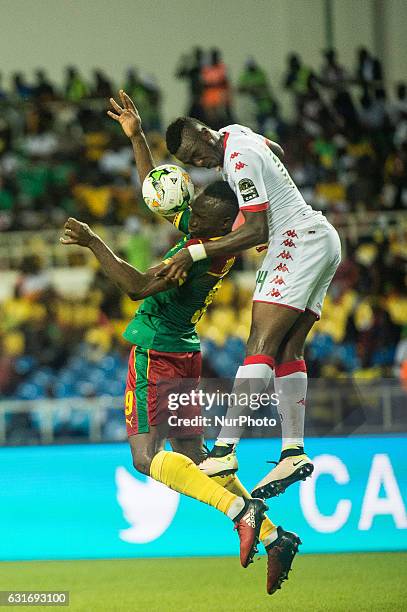 Zoua Daogari Jacques and Bakary Kone fighting about the ball during second half at African Cup of Nations 2017 between Burkina Faso and Cameroon at...