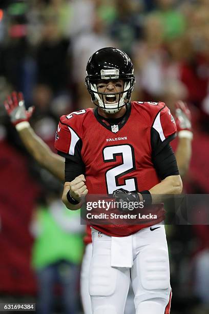 Matt Ryan of the Atlanta Falcons celebrates after scoring a touchdown against the Seattle Seahawks at the Georgia Dome on January 14, 2017 in...