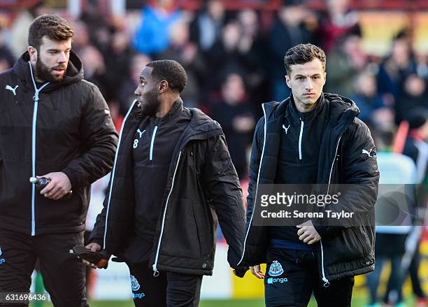 Newcastle Players seen L_R Grant Hanley, Vurnon Anita and Jamie Sterry walks out on to the pitch during the Championship Match between Brentford and...
