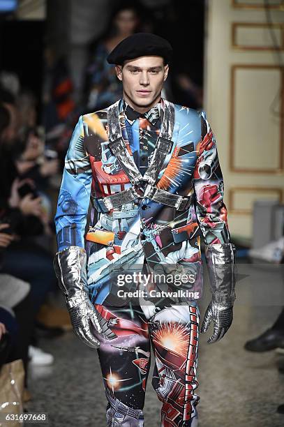 Matthew Noszka walks the runway at the Moschino Autumn Winter 2017 fashion show during Milan Menswear Fashion Week on January 14, 2017 in Milan,...