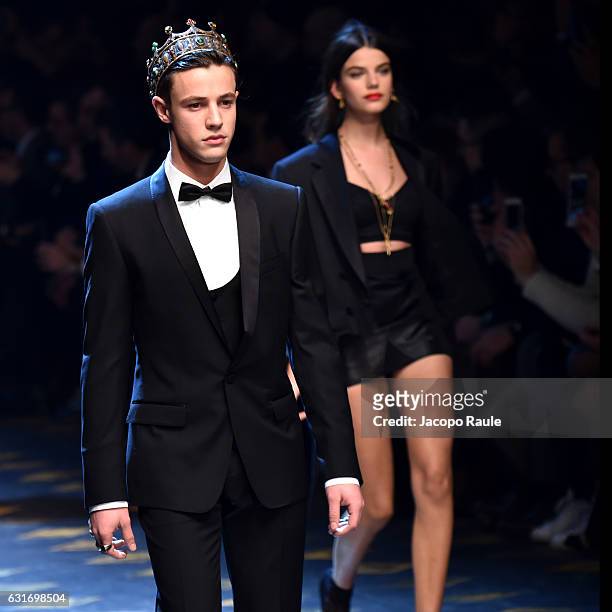 Cameron Dallas and Sonia Ben Ammar walk the runway at the Dolce & Gabbana show during Milan Men's Fashion Week Fall/Winter 2017/18 on January 14,...