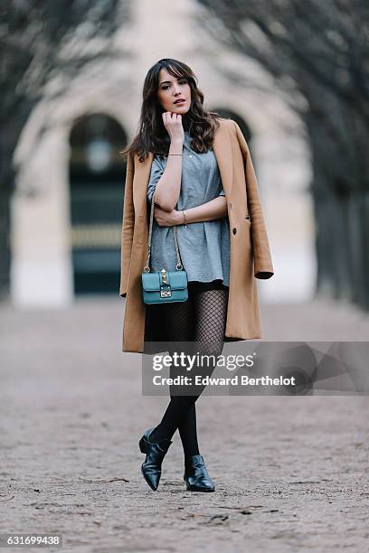 Sarah Benziane, fashion and life style influencer from the blog Les Colonnes de Sarah, is wearing a Zara brown long coat, a Zara gray dress, Zara...