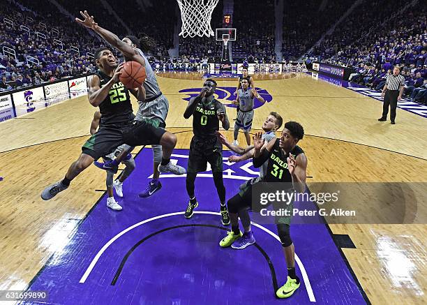 Guard Al Freeman of the Baylor Bears drives in for a basket against forward D.J. Johnson of the Kansas State Wildcats during the second half on...