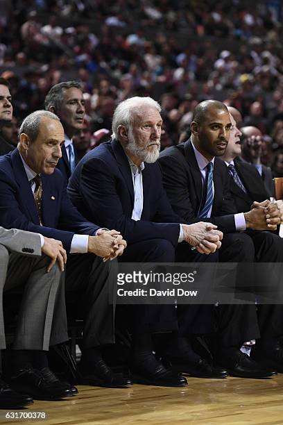 Ettore Messina, Gregg Popovich and Ime Udoka of the San Antonio Spurs watch the game from the bench during the game against the Phoenix Suns as part...