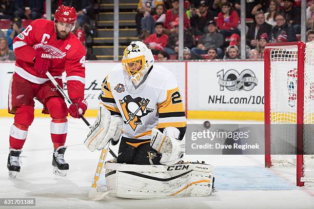 Gustav Nyquist of the Detroit Red Wings scores a goal on Marc-Andre Fleury of the Pittsburgh Penguins as Henrik Zetterberg of the Wings posts in...