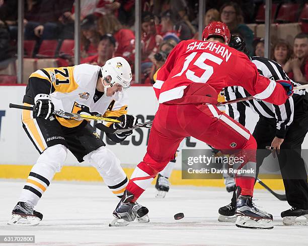 Evgeni Malkin of the Pittsburgh Penguins faces off against Riley Sheahan of the Detroit Red Wings during an NHL game at Joe Louis Arena on January...