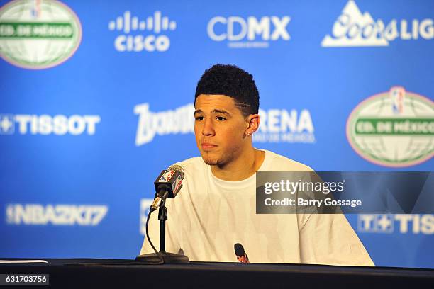 Devin Booker of the Phoenix Suns talks to the media during a press conference after the game against the San Antonio Spurs as part of NBA Global...