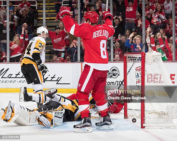 Thomas Vanek of the Detroit Red Wings scores a second period goal on Marc-Andre Fleury of the Pittsburgh Penguins as teammate Justin Abdelkader of...