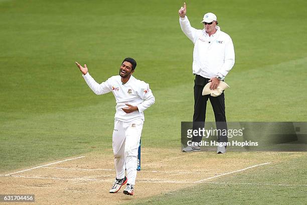 Mahmudullah of Bangladesh celebrates as umpire Paul Reiffel of Australia signals the dismissal of Tim Southee of New Zealand during day four of the...