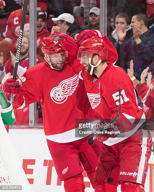 Frans Nielsen of the Detroit Red Wings celebrates his second period goal with teammate Thomas Vanek during an NHL game against the Pittsburgh...