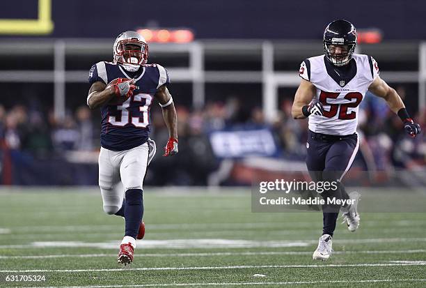 Dion Lewis of the New England Patriots runs the ball for a 98-yard kick off return touchdown against the Houston Texans during the AFC Divisional...