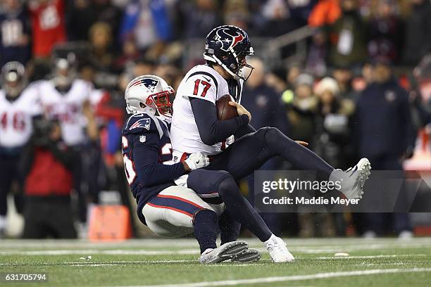 Logan Ryan of the New England Patriots sacks Brock Osweiler of the Houston Texans in the first half during the AFC Divisional Playoff Game at...