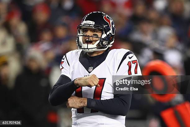 Brock Osweiler of the Houston Texans celebrates after C.J. Fiedorowicz scored in the second quarter against the New England Patriots during the AFC...