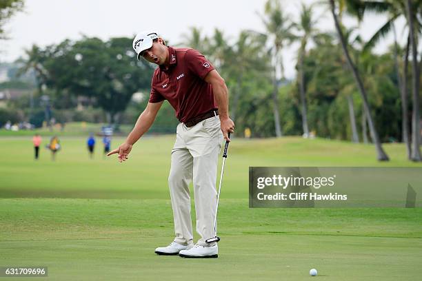 Kevin Kisner of the United States reacts to his missed eagle putt on the ninth green during the third round of the Sony Open In Hawaii at Waialae...