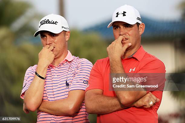Justin Thomas of the United States and Gary Woodland of the United States look on during the third round of the Sony Open In Hawaii at Waialae...