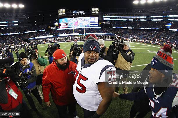 Dont'a Hightower of the New England Patriots greets Vince Wilfork of the Houston Texans after the Patriots defeated the Texans 34-16 in the AFC...