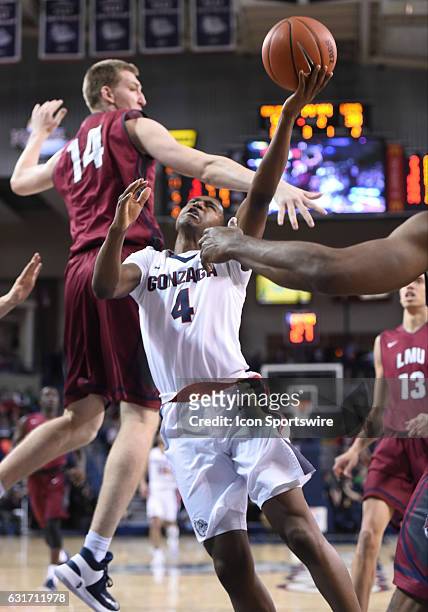 Gonzaga senior guard Jordan Mathews scores on this shot whlie being fouled during the game between the Loyola Marymount Lions and the Gonzaga...