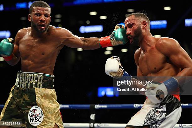 Badou Jack punches James DeGale during their WBC/IBF Super Middleweight Unification bout at the Barclays Center on January 14, 2017 in New York City.