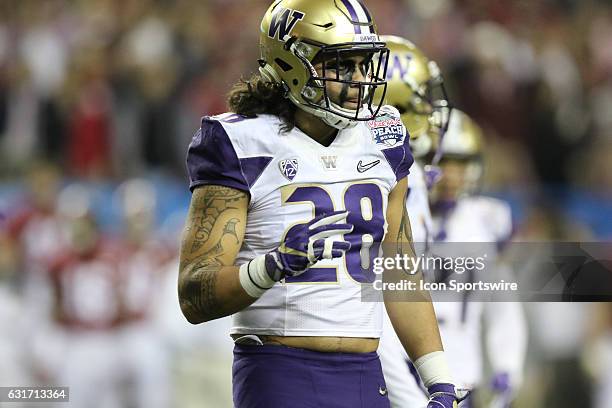 Washington Huskies linebacker Psalm Wooching during the College Football Playoff Semifinal at the Chick-fil-A Peach Bowl between the Washington...