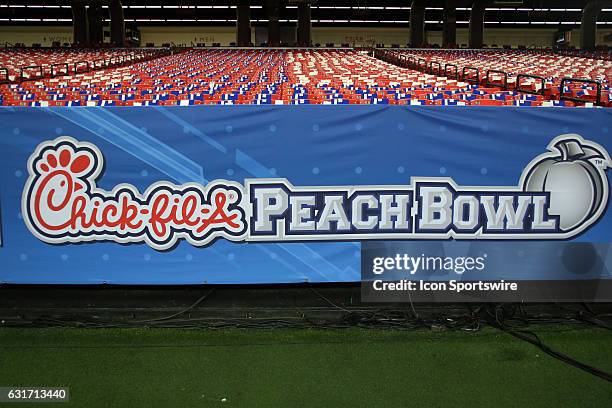 The Peach Bowl logo at the College Football Playoff Semifinal at the Chick-fil-A Peach Bowl between the Washington Huskies and the Alabama Crimson...